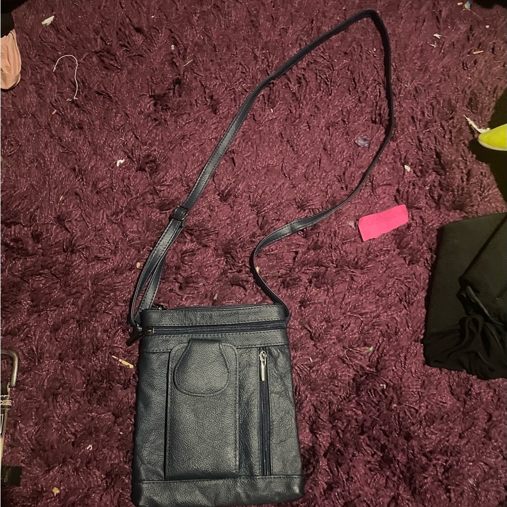 blue bag, can extend strap!! pretty much brand new. never been worn